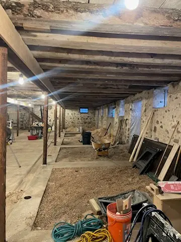 Old hand-hewn beams over the cleared lower level