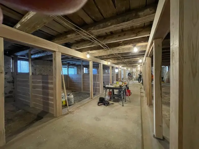 Stall walls in cedar down the center aisle