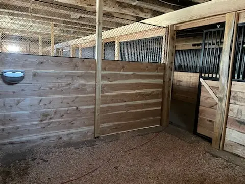 Stall gate detail in cedar and steel