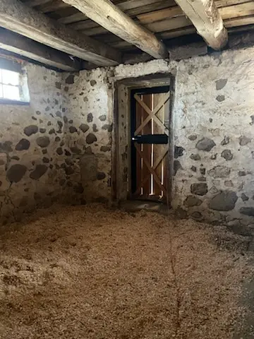 Stone-walled room with new dutch door