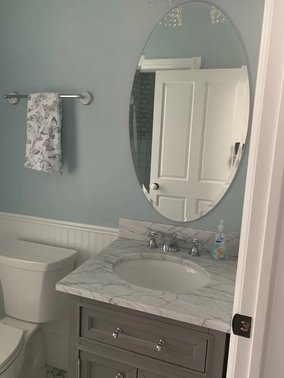 Finished vanity corner with butterfly towel and marble top