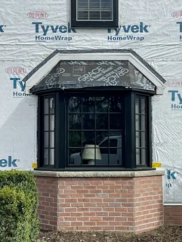 Second bay on brick base awaiting roof