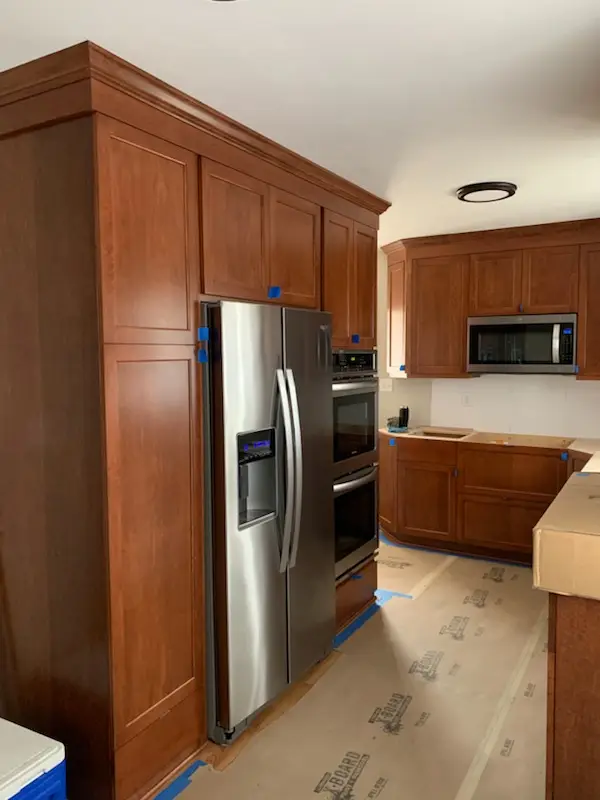 Fridge surround and pantry cabinets during install
