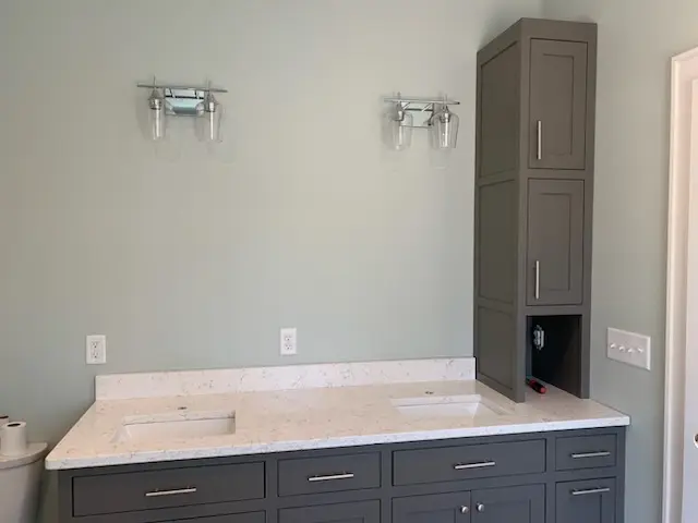 Double vanity with quartz top and tower cabinet