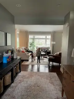 Refinished living room through a cased opening
