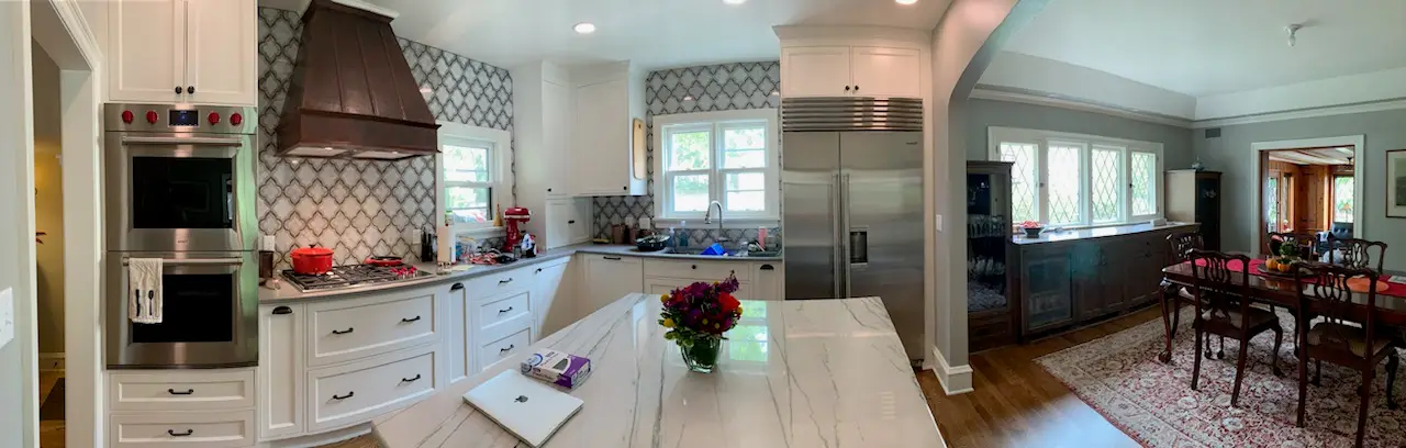 Panorama of the kitchen and dining room with leaded-glass windows